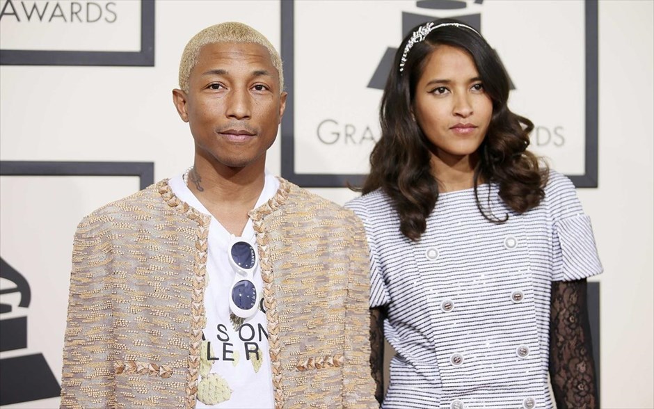 Βραβεία Grammy - Pharrell Williams and Helen Lasichanh . Ο τραγουδιστή Φάρελ Ουίλιαμς με τη γυναίκα του, στο κόκκινο χαλί της 58ης τελετής απονομής των μουσικών βραβείων Grammy.