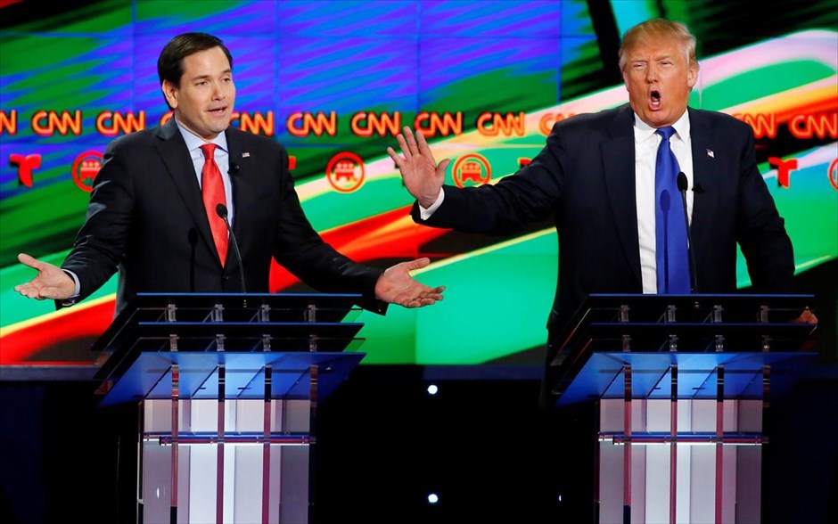 Εκλογές ΗΠΑ - Debate. Οι Ρεπουμπλικανοί Μάρκο Ρούμπιο (αριστερά) και Ντόναλντ Τραμπ, μιλούν ταυτόχρονα, κατά τη διάρκεια ντιμπέιτ του CNN μεταξύ των υποψηφίων για το χρίσμα του Ρεπουμπλικανικού Κόμματος στο Χιούστον, στο Τέξας (25 Φεβρουαρίου 2016).