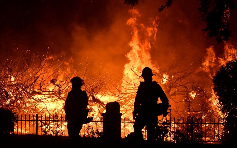 Firefighters battle a wind-driven wildfire called the Saddle Ridge fire in the early morning hours Friday in Porter Ranch. &nbsp;&nbsp;