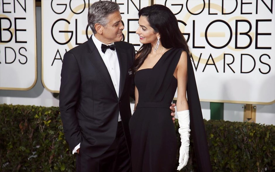 Χρυσές Σφαίρες 2015. Ο ηθοποιός Τζορτζ Κλούνεϊ με την γυναίκα του, Αμάλ Κλούνεϊ.