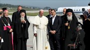 Pope Francis begins symbolic visit to Lesvos; greeted by Patriach