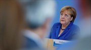 Bild: Η Μέρκελ θα πιέσει τις μεγάλες επιχειρήσεις να προσλάβουν περισσότερους πρόσφυγες