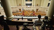 Latest austerity package generates sharp debate in Greek parliament; opposition charges 