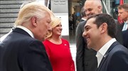 Trump crosses path with Greek PM Tsipras for the first time at NATO summit; chat with Merkel