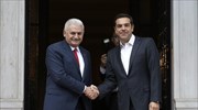 Turkish PM arrives in Athens; Tsipras refers to relations based on trust, cooperation