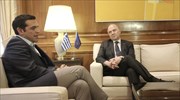 Tsipras buoyant over Tuesday bond issue in welcoming Moscovici