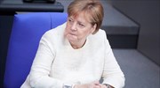 Merkel on refugee crisis deal with Greece; Die Welt links agreement with VAT hike postponement