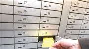 Greek revenue auditors given easier access to bank safety deposit boxes as of Jan. 1, continuing 