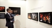 Greek PM tours exhibition of works by late photo-journalist Behrakis