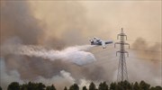Wildfire north of Athens, scorching heat wave strain Greece