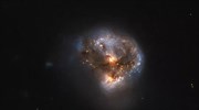 Λάμπει το φως γαλαξιακής σύγκρουσης που παράγει νέα άστρα στα βάθη του Σύμπαντος