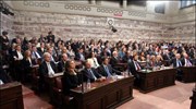 Βουλευτές του ΠΑΣΟΚ παρακολουθούν την ομιλία του προέδρου του κόμματος Γιώργου Παπανδρέου ...