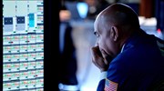 Περιορίστηκαν οι εβδομαδιαίες απώλειες της Wall Street